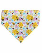 Load image into Gallery viewer, Dog bandana with bees and flowers pattern on a light blue background