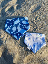 Load image into Gallery viewer, Reversible beach-themed dog bandana with whales and sailboats
