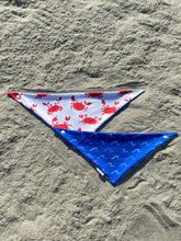 Load image into Gallery viewer, Reversible beach-themed dog bandana with red crabs and blue waves