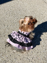 Load image into Gallery viewer, Coco wearing the Pink Purr-fection 3 tier harness dress with layered ruffle details
