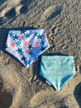 Load image into Gallery viewer, Reversible beach-themed dog bandana with starfish and ‘’beach hair don’t care’’
